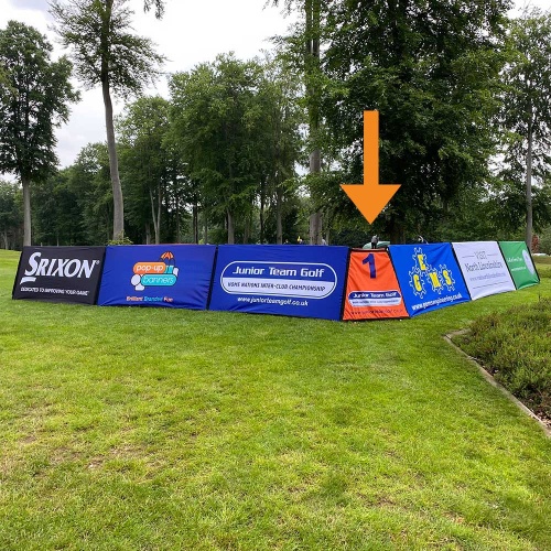 Branded rectangular pop-out corner banner units outside on the grass